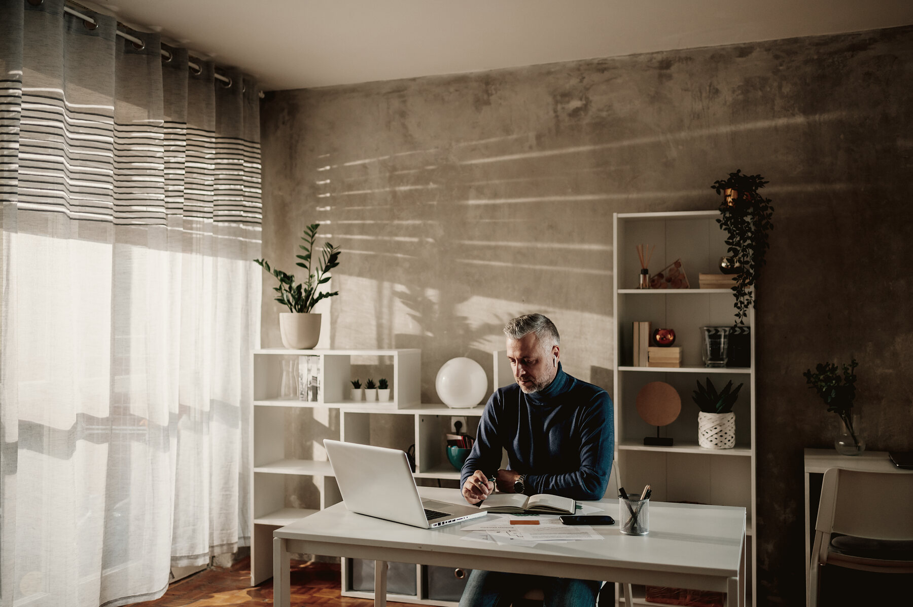 A specialist reading a project brief at a desk
